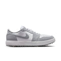 Gray and white sneaker with a Nike logo on a white background