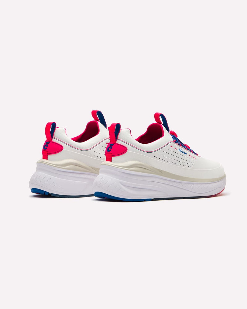 White sneakers with pink and blue accents on a white background