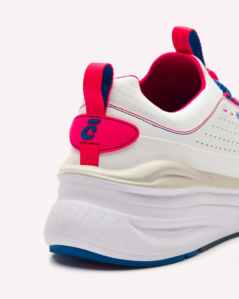 White sneaker with red and blue accents on a white background