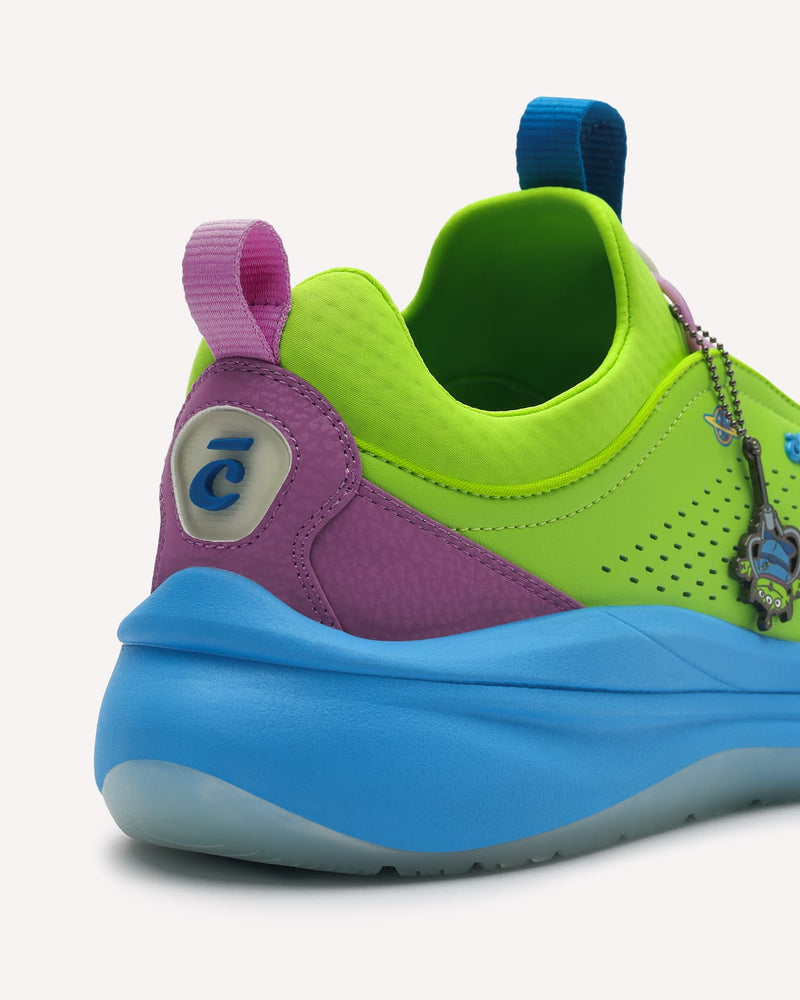 Colorful shoe with green, purple, and blue design on a white background
