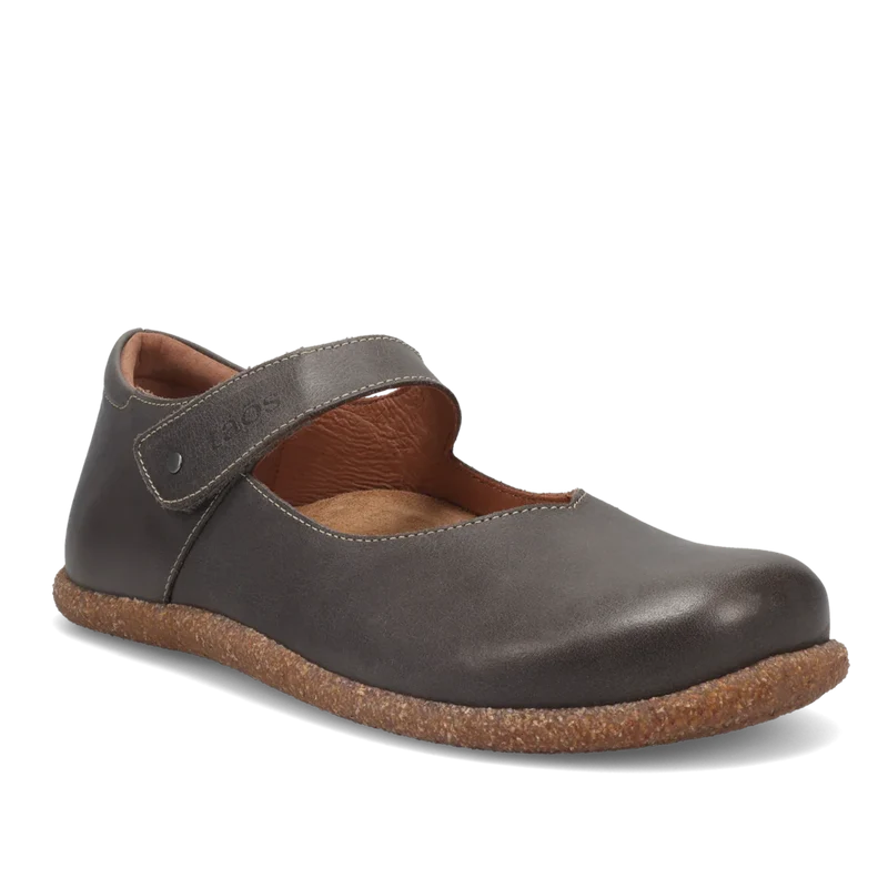 Brown leather shoe with cork sole on a white background