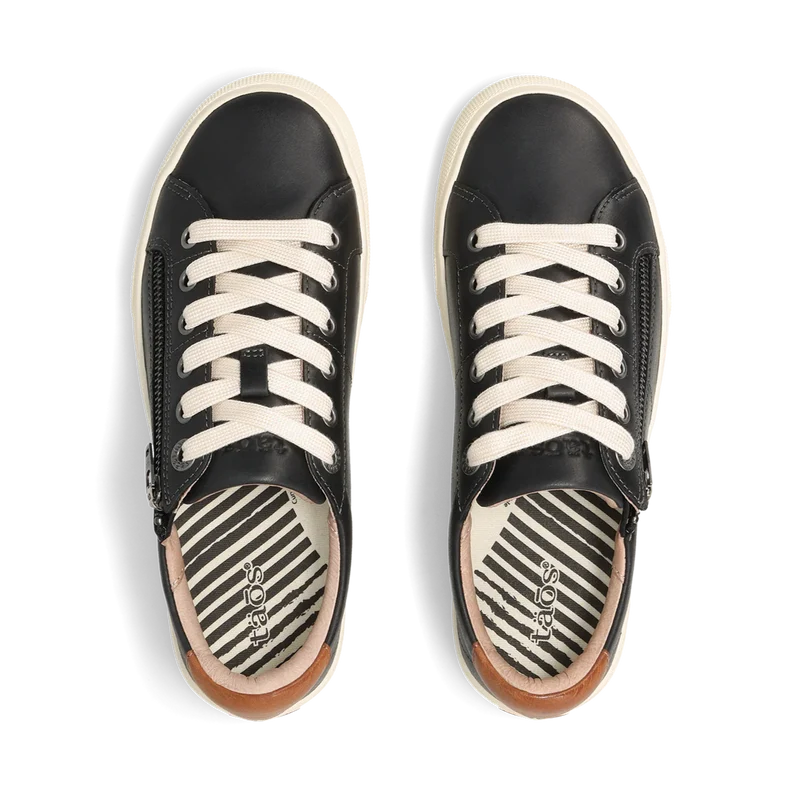 Black sneakers with white laces on a white background