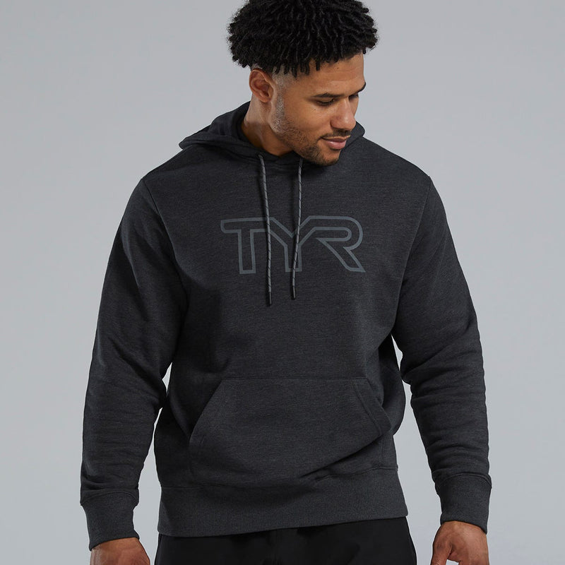 Man wearing a dark gray hoodie with TYR logo on a light gray background